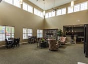 Thumbnail 6 of 15 - a large living room with furniture and a fireplace