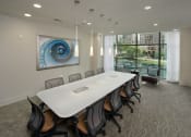 Thumbnail 15 of 23 - a conference room with a long white table and chairs