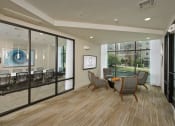 Thumbnail 16 of 23 - a conference room with glass walls and a table and chairs