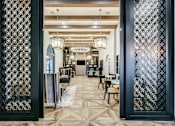 Thumbnail 17 of 33 - A room with a patterned floor and a patterned wall divider.