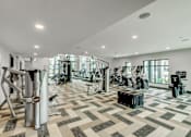 Thumbnail 13 of 33 - A spacious gym with a variety of equipment.