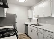 Thumbnail 2 of 20 - the preserve at ballantyne commons apartment kitchen with stainless steel appliances