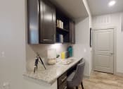 Thumbnail 1 of 23 - a home office with a desk and cabinets