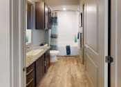Thumbnail 8 of 23 - a bathroom with a toilet sink and bathtub in a 555 waverly unit