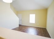 Thumbnail 4 of 16 - A room with a window and a door.