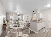 Thumbnail 5 of 14 - A well-lit, modern kitchen and dining area with a neutral color scheme.