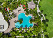 Thumbnail 2 of 44 - an overhead view of a swimming pool with palm trees