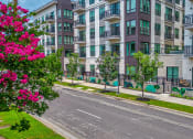 Thumbnail 10 of 41 - a view of an empty street in front of an apartment building