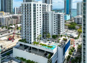Thumbnail 2 of 66 - an aerial view of a city with tall buildings and a pool