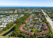 Thumbnail 6 of 46 - an aerial view of a neighborhood with a river in the background