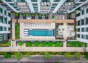 Thumbnail 32 of 41 - a birdseye view of a building with a swimming pool in the middle of it