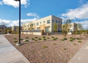 Thumbnail 15 of 46 - an exterior view of a building with a landscaped area