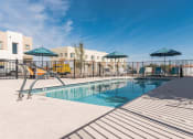Thumbnail 14 of 46 - our apartments have a swimming pool with chairs and umbrellas