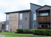 Thumbnail 24 of 27 - an apartment building and brick and a wooden balcony