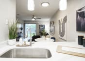 Thumbnail 6 of 33 - the view of the kitchen and living room from the counter top in a modern home