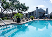 Thumbnail 52 of 68 - A swimming pool in front of a house.