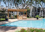 Thumbnail 49 of 68 - A pool with a bench and a canopy.