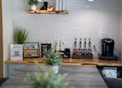 Thumbnail 62 of 68 - A white brick wall with a wooden shelf above it.