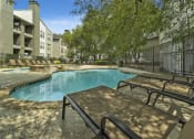 Thumbnail 30 of 40 - our apartments have a resort style pool and lounge chairs