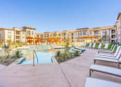Thumbnail 22 of 33 - resort style pool with lounge area in midland texas apartment