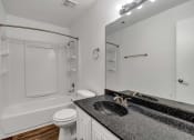 Thumbnail 14 of 23 - a bathroom with a sink and a toilet