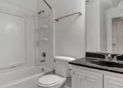 Thumbnail 15 of 23 - a bathroom with a sink toilet and bathtub