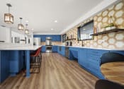 Thumbnail 21 of 44 - a kitchen with blue cabinets and white countertops