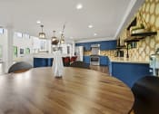 Thumbnail 23 of 44 - a large dining table with a view of the kitchen and living room