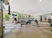 Thumbnail 39 of 44 - the gym at the enclave at woodbridge apartments in sugar land, tx