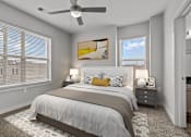 Thumbnail 3 of 17 - A bedroom with a large bed and a ceiling fan.