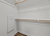 Thumbnail 37 of 39 - A white wall with a white electrical box and a white shelf.