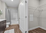 Thumbnail 12 of 39 - A white door is open to a walk-in closet.
