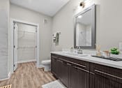 Thumbnail 10 of 39 - A bathroom with a walk-in shower and a sink.