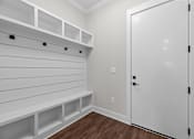Thumbnail 12 of 37 - A white closet with a door and shelves.
