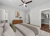 Thumbnail 5 of 37 - A bedroom with a bed, dresser, and mirror.