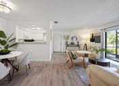 Thumbnail 14 of 27 - the living room and dining area of an apartment