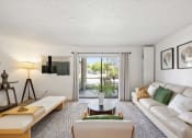 Thumbnail 15 of 27 - a living room with a white couch and a sliding glass door