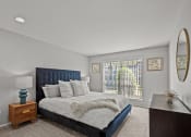 Thumbnail 6 of 21 - a bedroom with a large bed and a window
