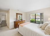 Thumbnail 39 of 46 - a bedroom with a large bed and a large window