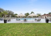 Thumbnail 2 of 46 - a swimming pool with umbrellas and chairs around it