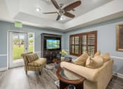Thumbnail 15 of 46 - a living room filled with furniture and a flat screen tv