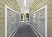 Thumbnail 19 of 39 - A long hallway with mailboxes on both sides.