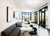 Thumbnail 21 of 26 - A modern living room with a large window and a view of the city.
