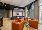Thumbnail 11 of 66 - a large lobby with couches and chairs