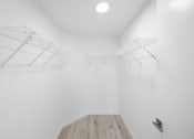 Thumbnail 44 of 66 - a room with white walls and a wooden floor