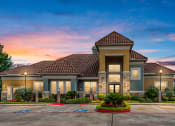 Thumbnail 1 of 38 - parking lot view of the main entrance