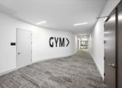 Thumbnail 14 of 66 - a view down a long corridor with a large logo on the wall