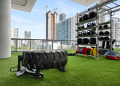 Thumbnail 28 of 66 - a gym with a view of the city