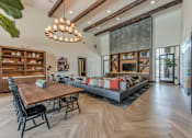 Thumbnail 13 of 28 - A modern dining room with a wooden table and chairs.
