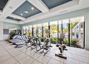 Thumbnail 24 of 47 - A gym with treadmills and exercise bikes.
